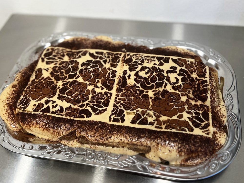 Tiramisu with a rose cocoa stencil