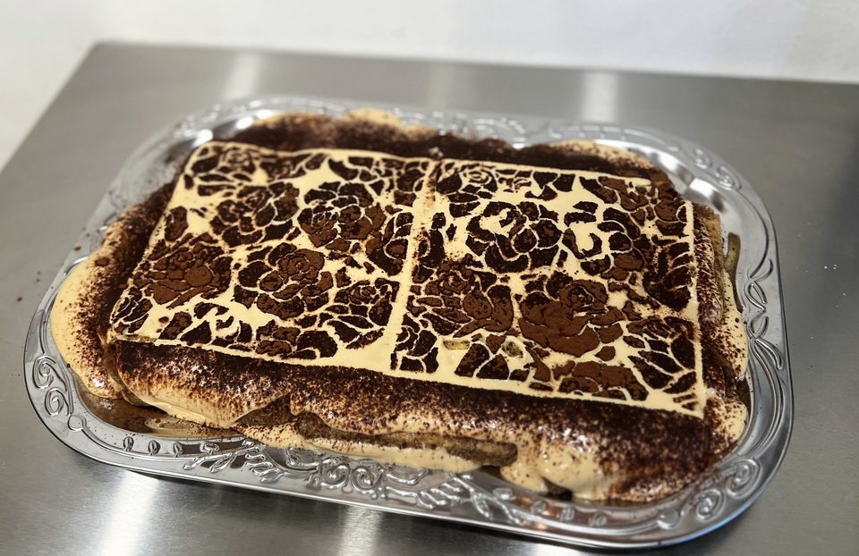 Tiramisu with a rose cocoa stencil